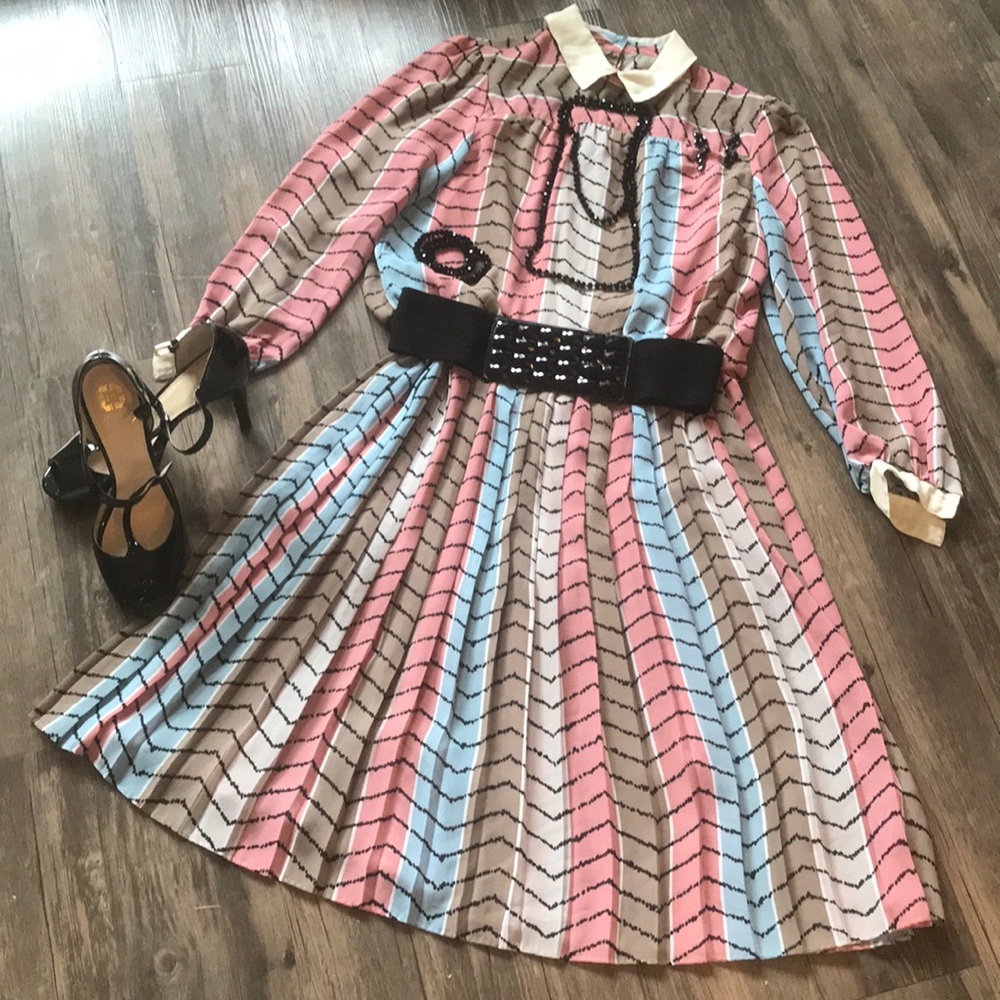 A tan, blue, pink, blue, and black dress